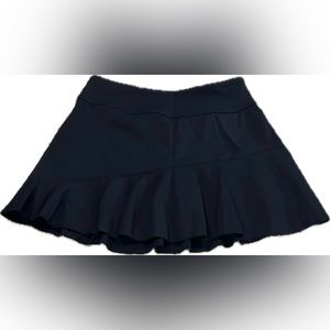Women’s black tennis skirt.